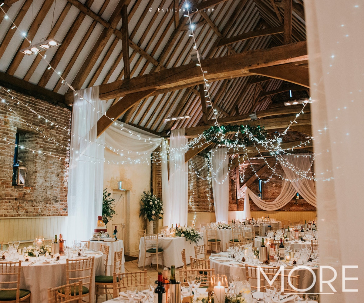 Barn Wedding Décor with Fairy Light Ceiling Canopy and Voile Drape
